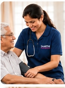 A Saarthi companion checking an elderly man's blood pressure at the hospital